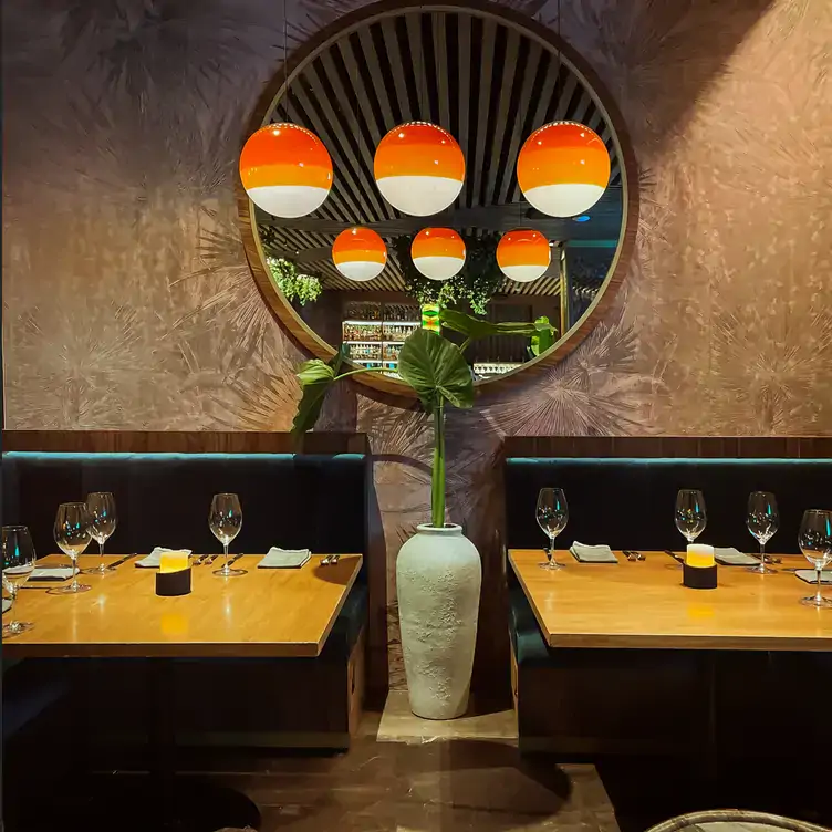 View of the interior of Porfirio's restaurant with wooden tables, and classic decoration.